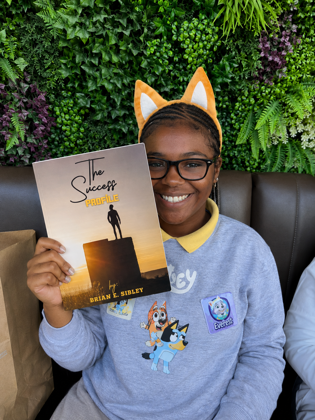 A young reader holding The Success Profile